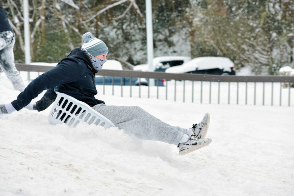 february snow sledding by hannah adamson