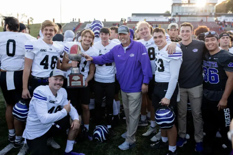 Todd Knight with players after beating HSU 2024 photo by Meghann Bledsoe