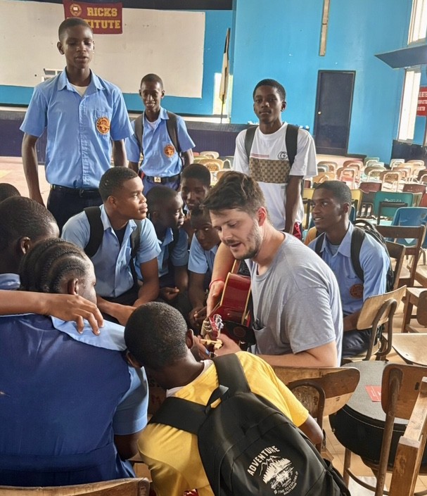 Arkansas Baptists explore ministry opportunities in Liberia, West Africa 2 Dakota playing guitar with Ricks students