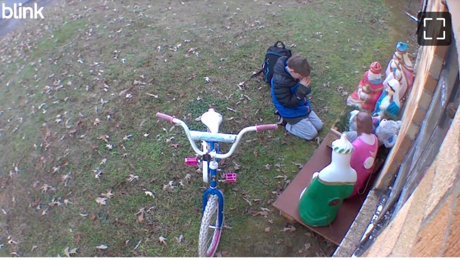 Boy gifts baby Jesus a football and teddy bear 1 Photo Dec 15 2025 1 06 10 PM
