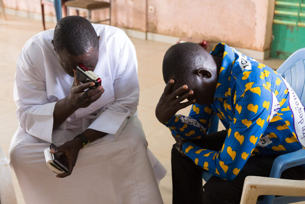 West Africans find hope amid horror 1 imb photos heads bowed small